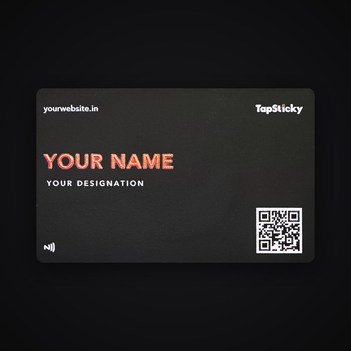 Black hybrid stainless steel NFC business card, about 1 mm thick, with a red UV-printed name, a QR code and an NFC symbol
