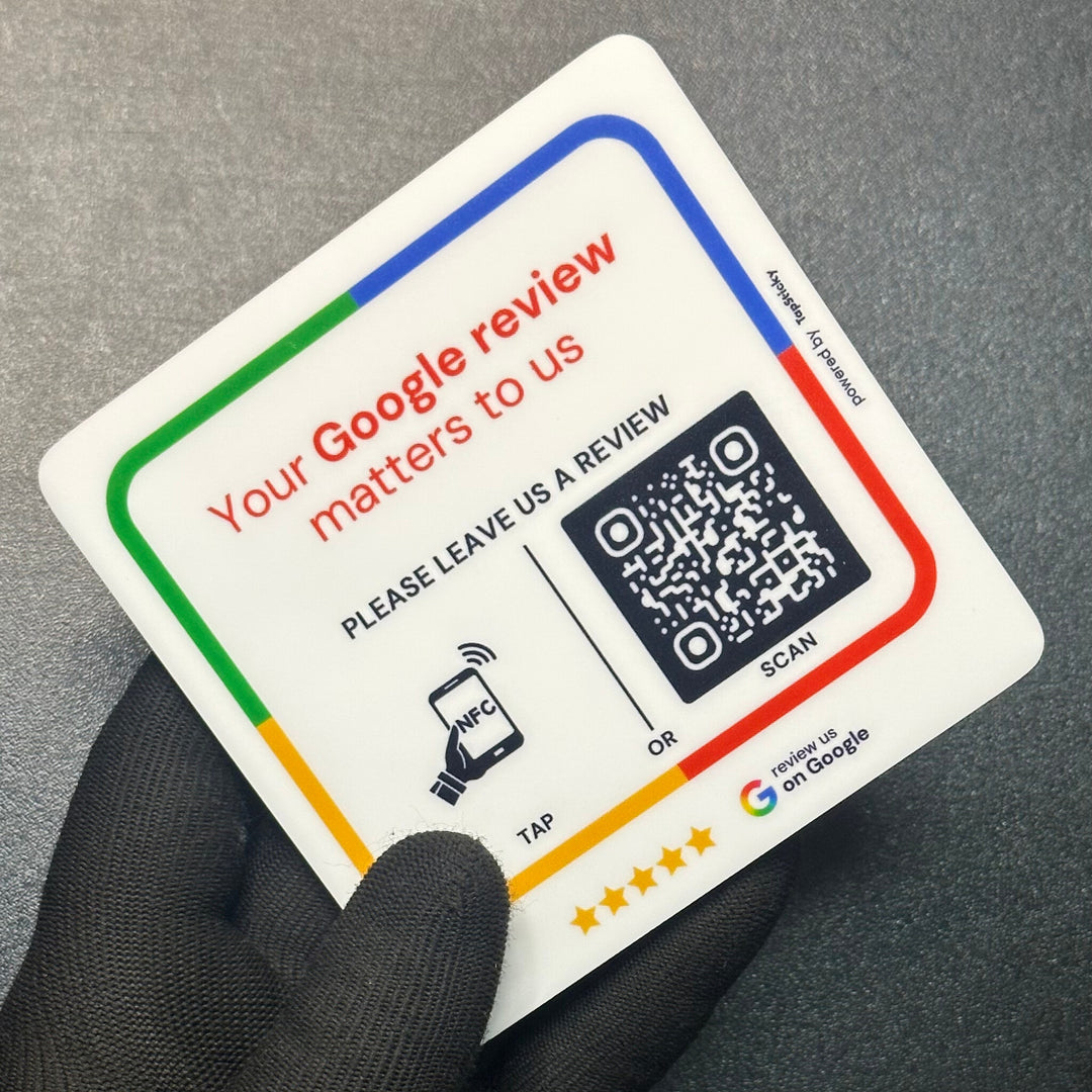 Hand holding the 10 x 10 cm acrylic review plate, 3 mm thick, bigger than a card