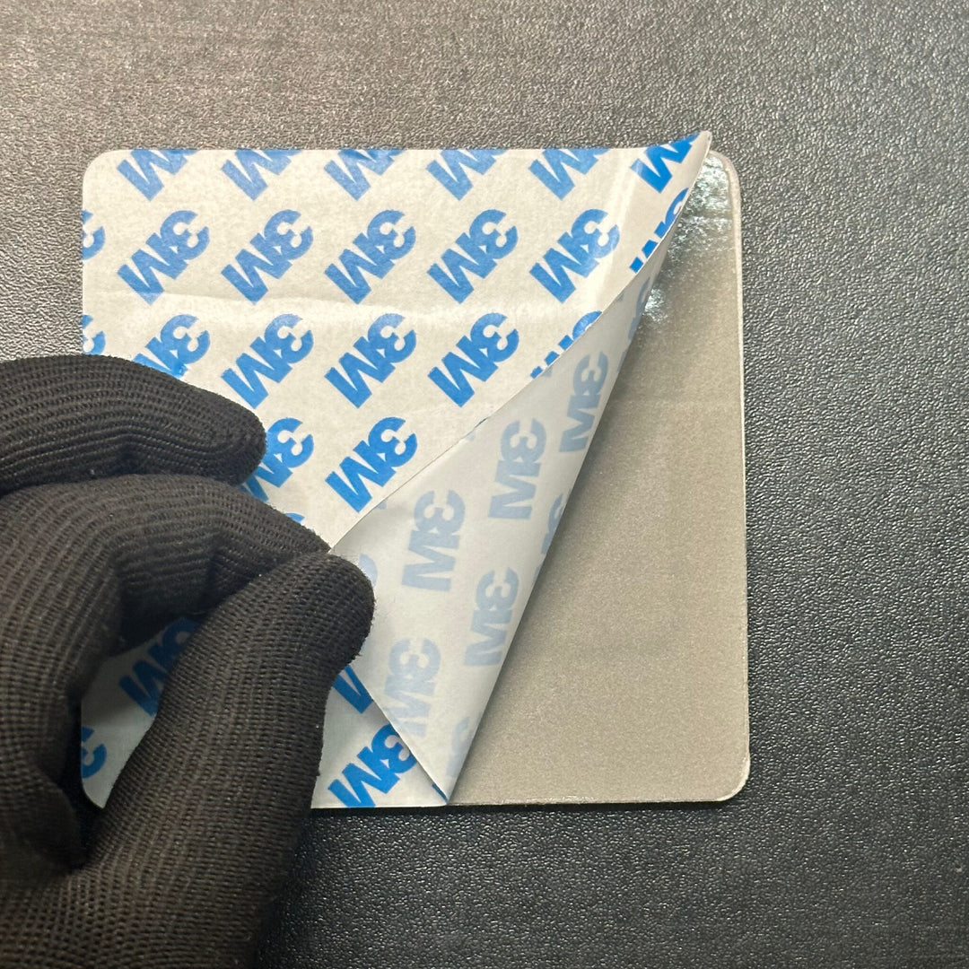 Peeling the liner off the 3M tape on the back of the review plate before sticking it on a counter