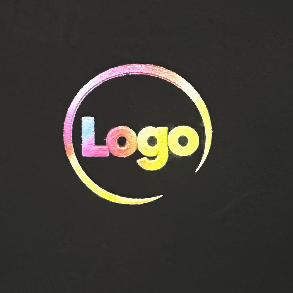 Close-up of a full-colour UV-printed logo on a black metal card