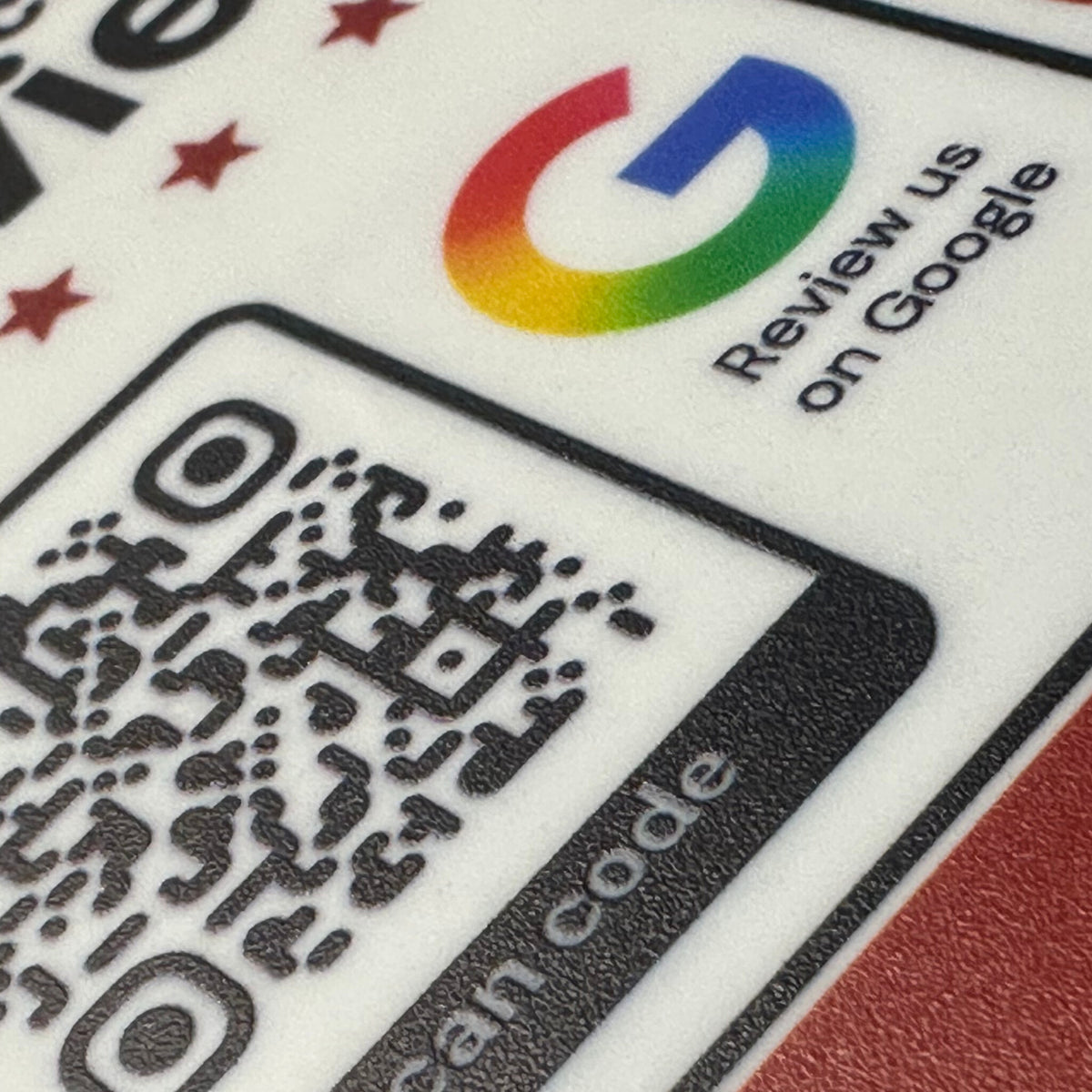 Close-up of the UV-printed QR code, stars and Review us on Google text on the acrylic plate