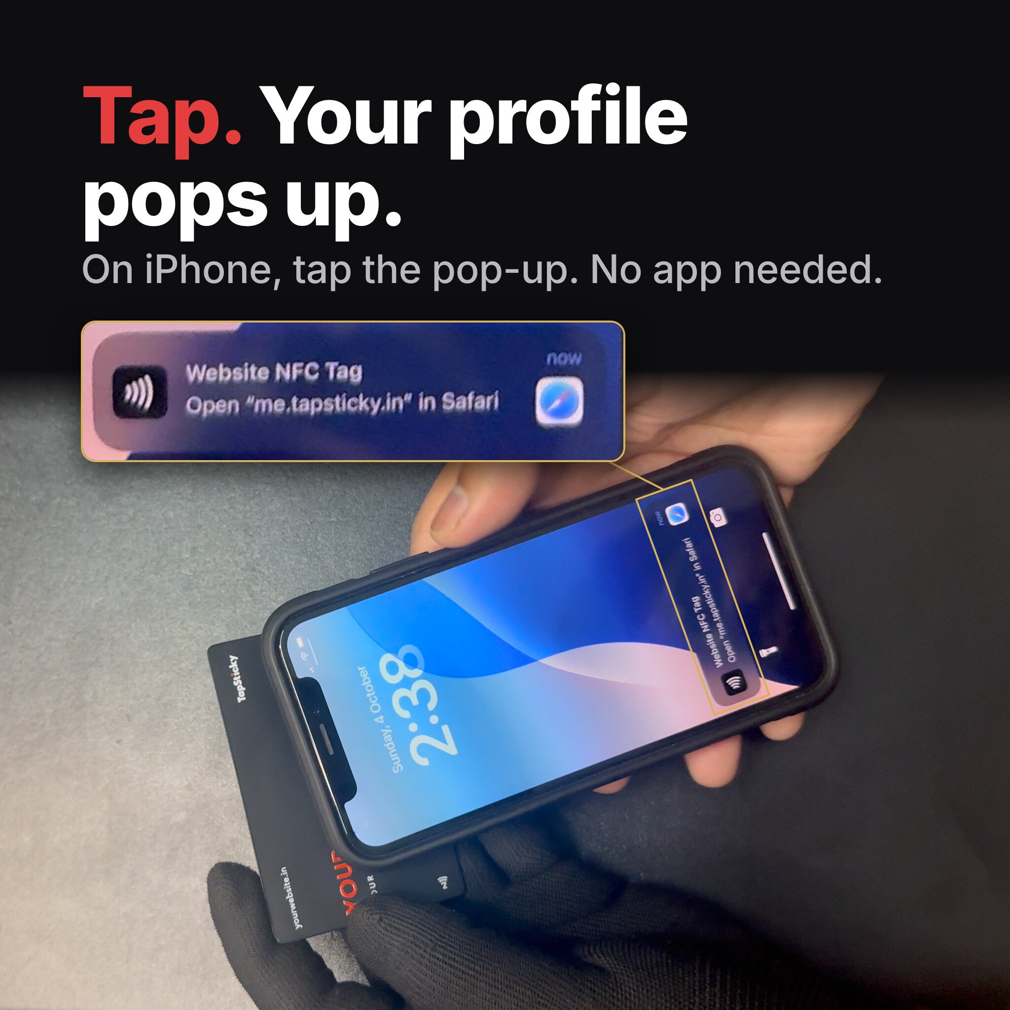 iPhone held over a black metal NFC card